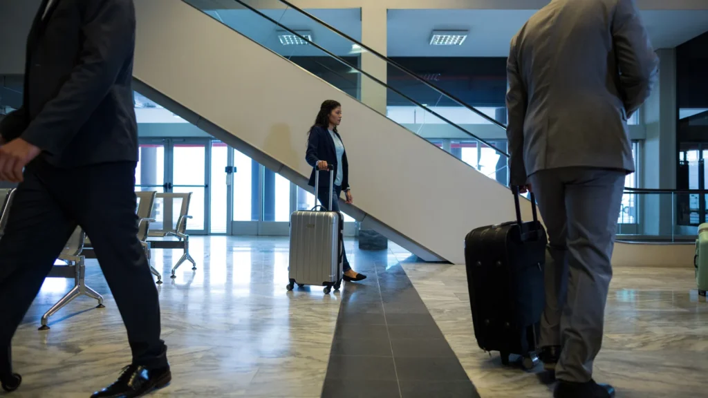 Business travellers in an airport terminal, representing sales across European markets